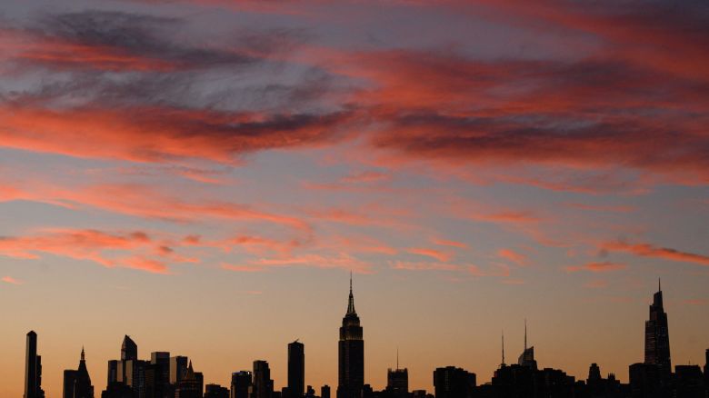 The Manhattan city skyline during sunset in Brooklyn, New York on June 27, 2022.