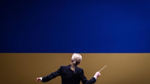 conductor Kerii-Lynn Wilson leads musicians from the Ukrainian Freedom Orchestra during a rehersal in Warsaw Opera before their international tour, July 28, 2022. - Members of musical ensembles from the four corners of Europe and Ukraine, from the National Opera of Brittany to the Opera of Kherson, are reunited for a tour and will play twelve dates, in the name of the freedom of Ukraine. (Photo by Wojtek RADWANSKI / AFP) (Photo by WOJTEK RADWANSKI/AFP via Getty Images)