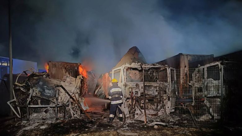 Firefighters work near damaged trucks following a Russian strike, amid Russia's attack on Ukraine, at a location given as Odesa region, Ukraine, in this handout picture released September 26, 2023. Odesa Regional Military Administration/Handout via REUTERS   THIS IMAGE HAS BEEN SUPPLIED BY A THIRD PARTY NO RESALES. NO ARCHIVES MANDATORY CREDIT