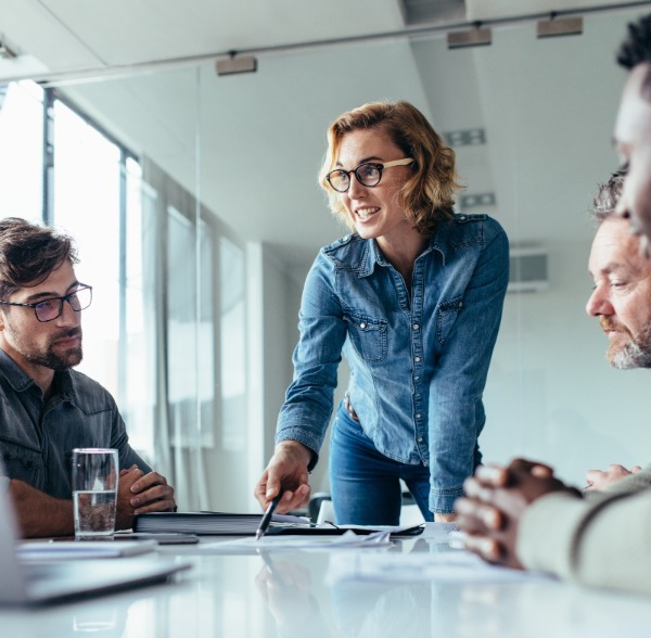 Woman Talking to Colleagues