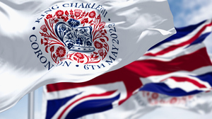 Waving flags: One for the coronation of Charles III (foreground) and the Union Jack (background)