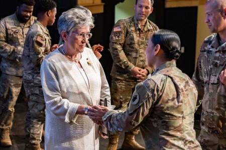 U.S. Army Chief Warrant Officer 5 and Gold Star Mother, Candy Martin, shakes hands with Lt. Col. Michelle Martinez, the battalion commander of Headquarters and Headquarters Battalion, U.S. Army South, at the Joint Base San Antonio-Fort Sam Houston theater on September 21, 2023. Martin spoke to U.S. Army South Soldiers about her son’s, 1st Lt. Thomas Martin, story and the importance of the Gold Star Mother&#39;s and Families Day.