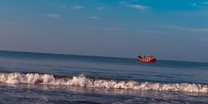 A boat sailing on the cox's Bazar sea beach.