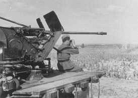 German soldier guarding Soviet prisoners of war