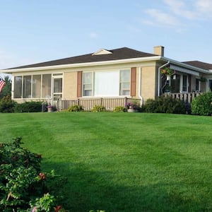 A bungalow with a large front yard