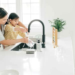 Mom and daughter washing dishes in the kitchen