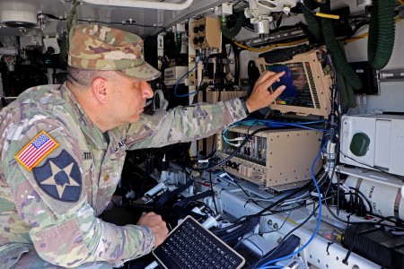 Army DEVCOM C5ISR Center personnel research the C5ISR/EW Modular Open Suite of Standards project during Network Modernization Experimentation 23 at Joint Base McGuire-Dix-Lakehurst, N.J., in August 2023. 