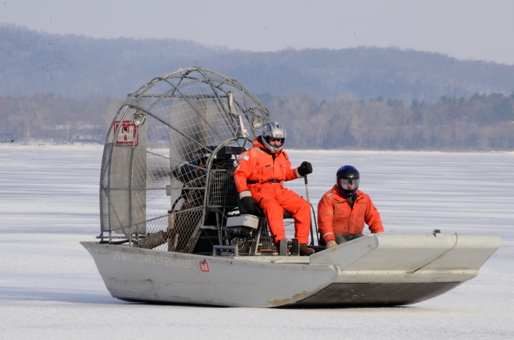 WABASHA, Minn. – U.S. Army Corps of Engineers, St. Paul District employees Al VanGuilder, left, survey technician, and Bill Chelmowski, marine machinery mechanic, use an airboat to  measure ice on Lake Pepin, near Wabasha, Minn., Feb. 13, during the first Mississippi River ice surveys of the year. The district conducts the annual ice surveys to help the navigation industry determine when it is safe to break through the ice. Lake Pepin, located on the Mississippi River between Red Wing and Wabasha, Minn., is used as the benchmark because the ice melts slower in this area due to the lake width and the slower current.