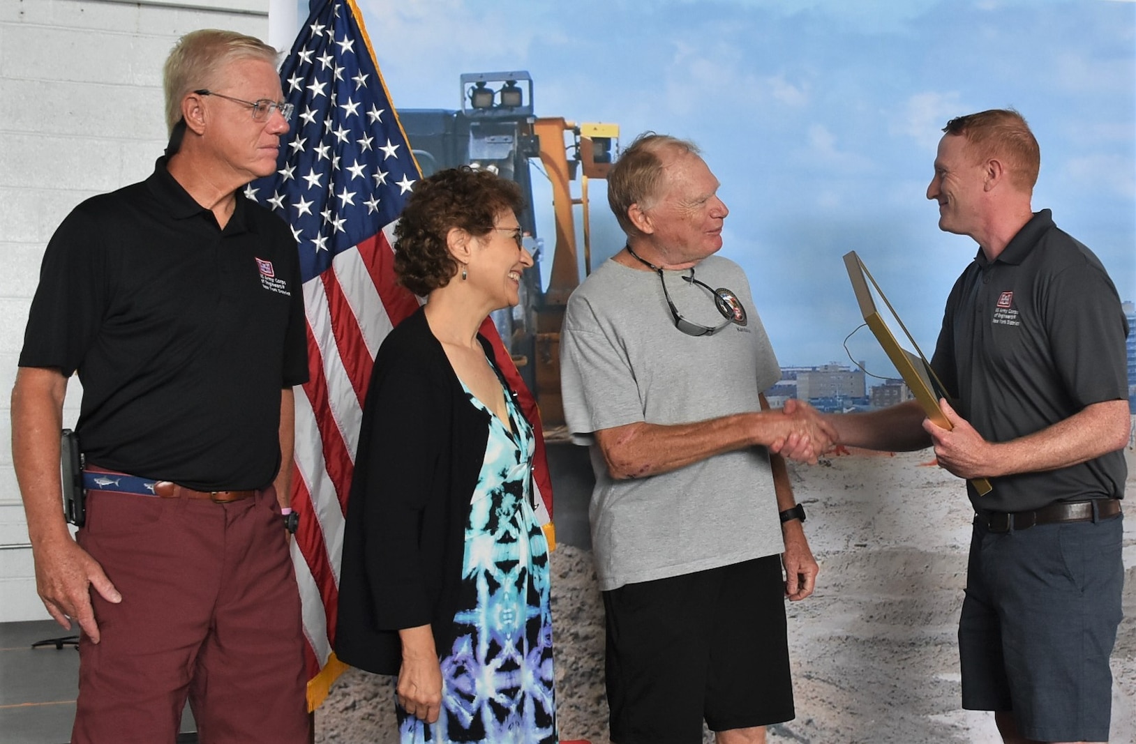 Bill Slezak, second from right, being congratulated by New York District Commander Col. Alexander Young recognizing his induction into the District's Hall of Fame, as his wife, Rickey, and  Deputy District Engineer and Chief of Programs and Project Management Division Joseph Seebode look on.