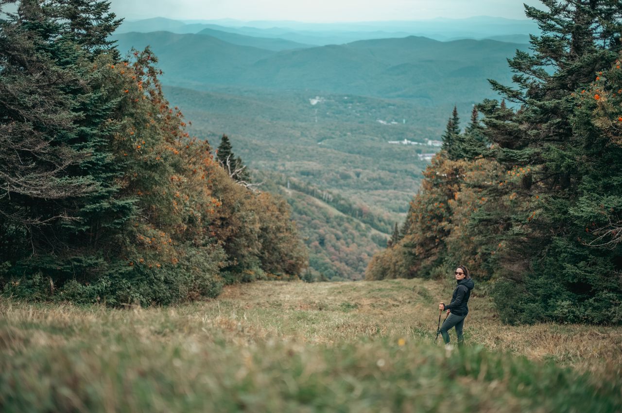 Vanessa hiking down what is a ski slope in winter.