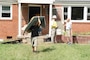 Robert Burick, emergency management specialist with the Louisville District and member of the U.S. Army Corps of Engineers debris response team, talks with volunteers removing debris Sept. 3, 2021 from a flood home in Waverly, Tennessee. Burick is providing technical assistance following deadly flooding in Tennessee when up to 17 inches of rain fell in the region Aug. 21. (USACE Photo by Lee Roberts)