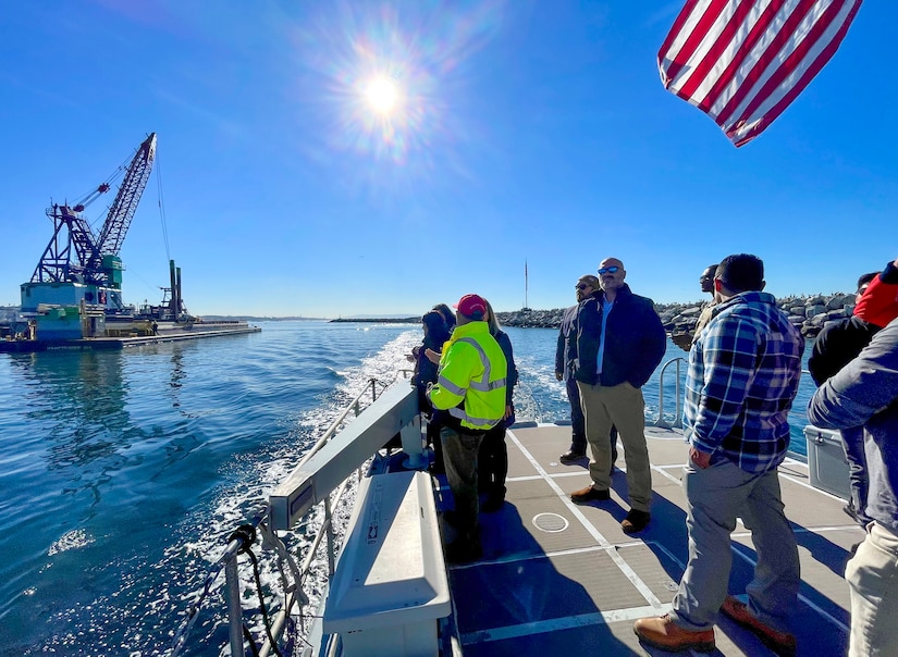 Members of the U.S. Army Corps of Engineers Los Angeles District project-delivery team managing the ongoing Marina del Rey Harbor dredging project join partners with the LA County Department of Beaches and Harbors to see dredging operations in action Jan. 9 at the harbor's entrance channel in LA County, California.