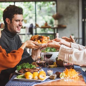 Group of people sharing Thanksgiving meal