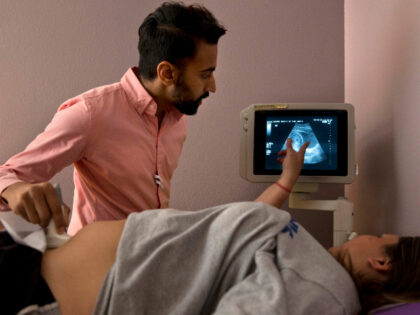 SOCIAL VALUES: Dr. Bhavik Kumar, 31, listens to a question from a patient considering abor