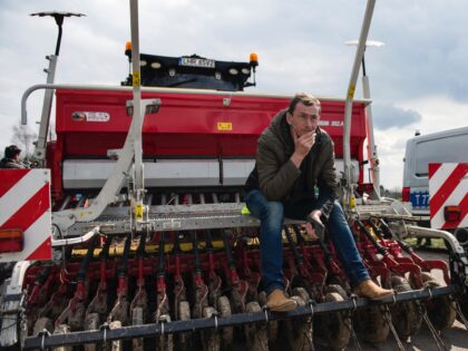 HRUBIESZOW, LUBLIN VOIVODESHIP, POLAND - 2023/04/12: A protesting farmer seats on his harv