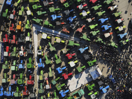 Protesting farmers with their tractors take part in a rally outside an agricultural fair i