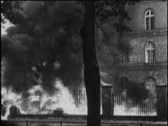 The Treaty of Versailles, imposed on defeated Germany following World War I, declared Danzig to be a free city jointly administered by Poland and the League of Nations. Germany bitterly resented the loss of this largely German city, which was also an important port on the Baltic Sea. The return of Danzig became a central feature of Adolf Hitler's foreign policy. This footage shows pro-German forces besieging a Polish garrison in Danzig's main post office. Germany annexed Danzig after the defeat of Poland in September 1939.