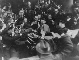 Germans cheer Adolf Hitler as he leaves the Hotel Kaiserhof just after being sworn in as chancellor. Berlin, Germany, January 30, 1933.