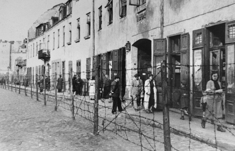 <p>View of a barbed-wire fence separating part of the ghetto in Krakow from the rest of the city. Krakow, Poland, date uncertain.</p>
<p>During the <a href="/narrative/72">Holocaust</a>, the creation of <a href="/narrative/286">ghettos</a> was a key step in the Nazi process of brutally separating, persecuting, and ultimately destroying Europe's Jews. Ghettos were often enclosed districts that isolated Jews from the non-Jewish population and from other Jewish communities.</p>