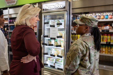 Honorable Christine Wormuth, secretary of the Army, speaks with Sgt. Maj. Kresassidy McKinney, III Armored Corps chief culinary management sergeant major, about the options available at the Culinary Outpost Food Kiosk Jan. 31, 2024. 