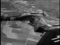 The Junkers (Ju) 87, known as the "Stuka," spearheaded the Blitzkrieg ("lightning war") attacks that were decisive in the western campaign in 1940. Stuka dive-bombers closely supported German forces on the ground. They destroyed enemy strong points, aircraft, and airfields, and spread panic in rear areas. Although slow and easily shot down by Allied fighters, the Stukas proved devastatingly effective in the German invasions of Poland and western Europe, where Germany enjoyed air superiority. Stuka dive-bombers caused terror among Allied ground forces, who came to recognize the telltale shriek of a bomber's dive. This German newsreel footage shows (from both the air and the ground) destruction caused by Stuka attacks during the western campaign in Flanders.