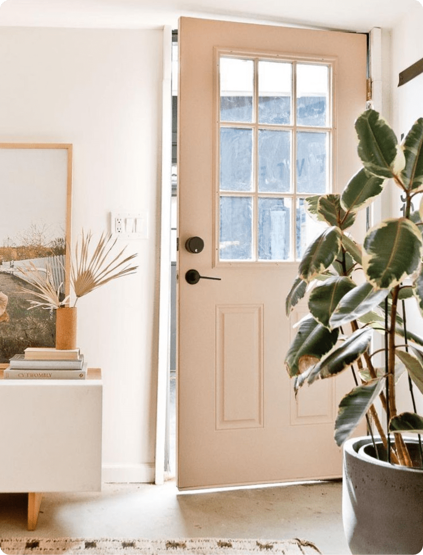 Front door with a black August smart lock set