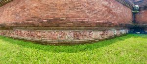 A historical building wall with sculpture tiles