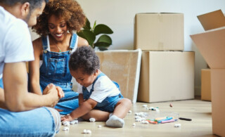 Parents watch daughter play in new house