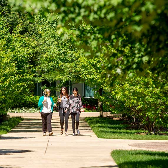 students walking outside of campus