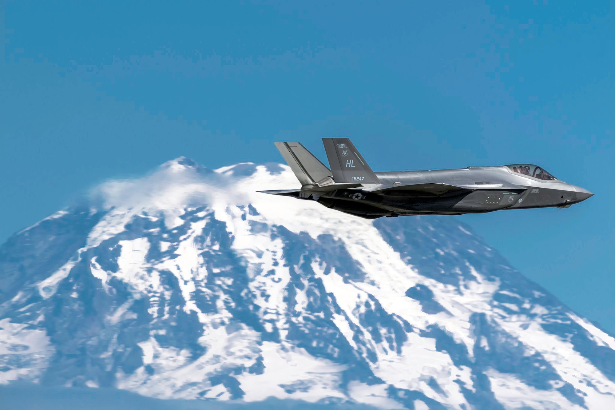 F-35A Lighting II Flying with Tacoma Mountains on Flank