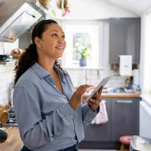 Woman controlling the lights in her house