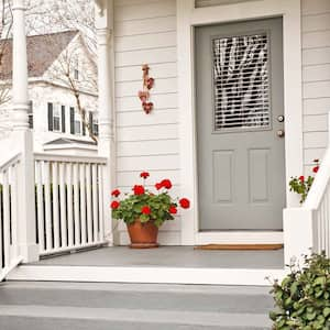 House front porch with steps and geraniums