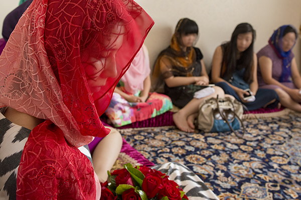 Photo: Uyghur women in Xinjiang province. Courtesy of Alexandra WilliamsQuote: Uyghur activist Mamatjan Juma. USHMM interview