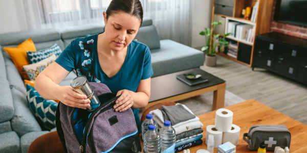 woman packing emergency kit