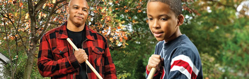 Dad and son raking