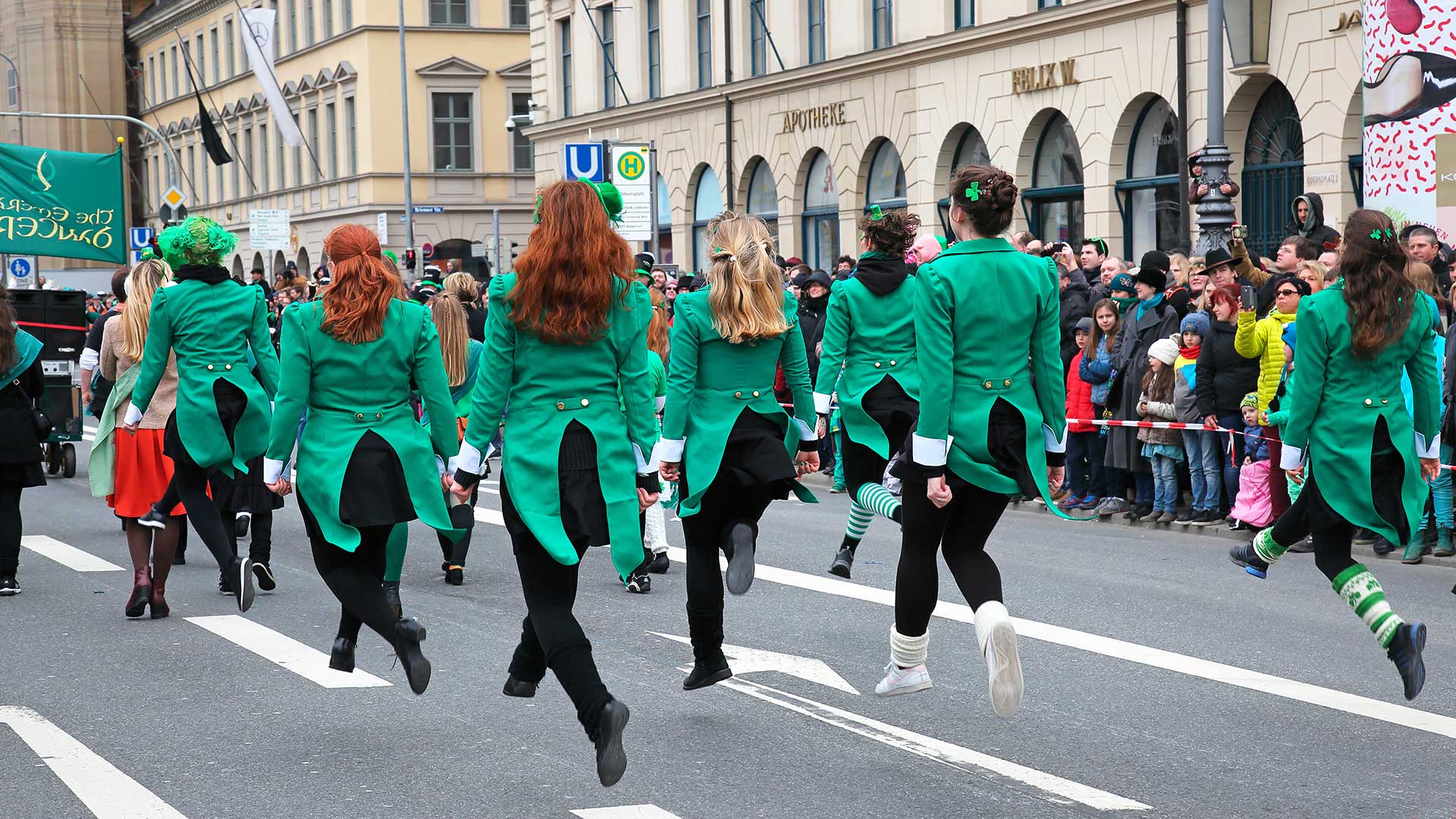 Dancers dressed in green performing in a St. Patrick's Day parade in Munich.