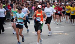 Picture of women and men running in the Boston Marathon.