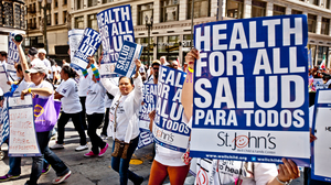 People holding posters and banners dedicated to immigration and healthcare reform.