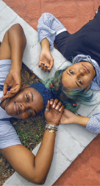 two teenagers holding hands