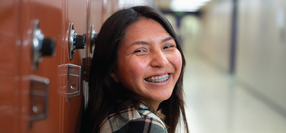 girl smiling at school locker