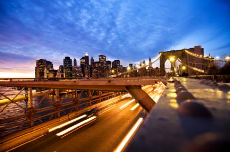 New York City Skyline Manhattanview from the Brooklyn Bridgemotion blur from the cars in the rush hour