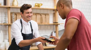 Shopper paying with a credit card. 