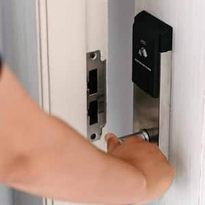 Woman opening a door in apartment