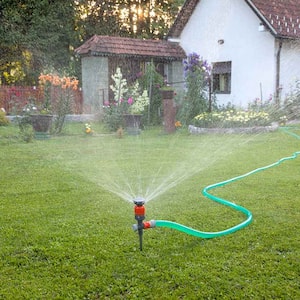 Watering the yard with automated sprinkler