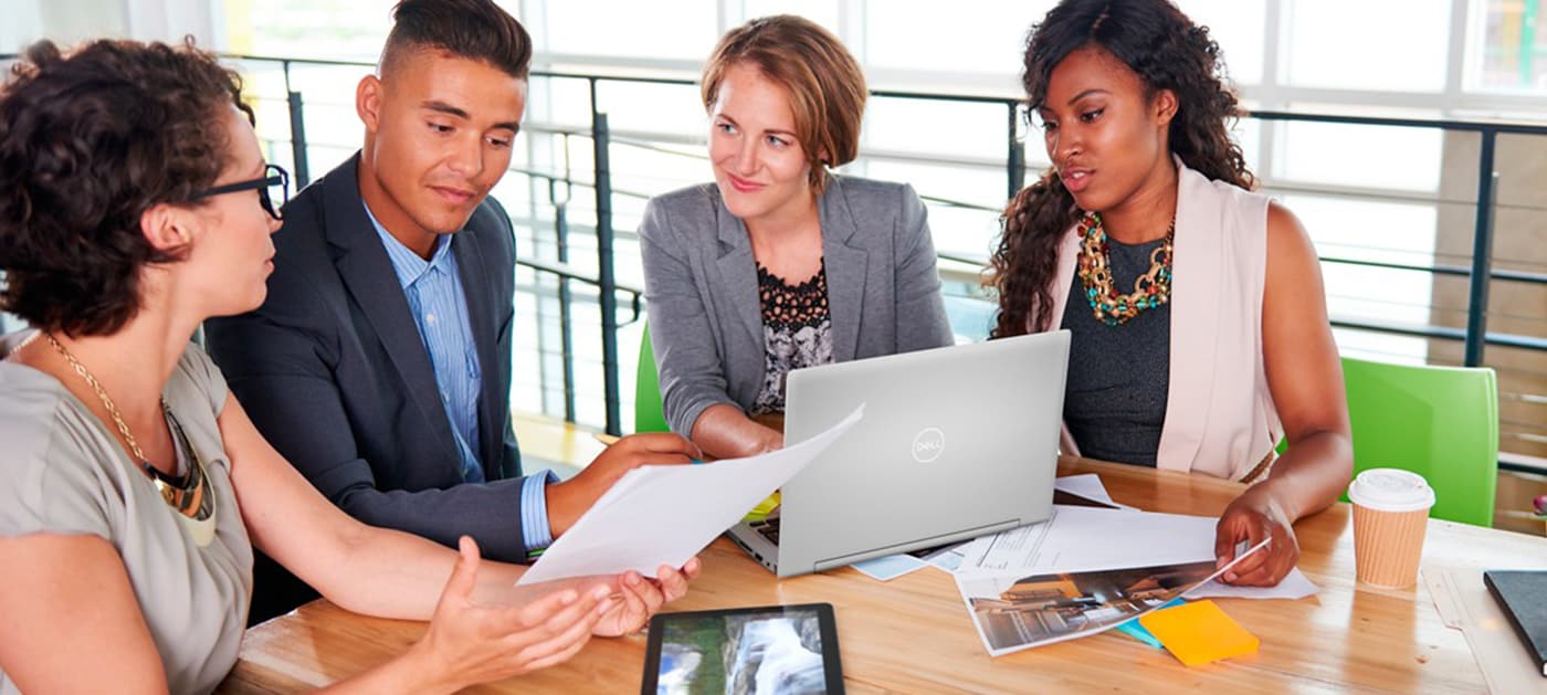 Team of Successful Business People Having a Meeting in Executive Sunlit Office