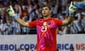 Emi Martínez celebrates after saving during the penalty shootout