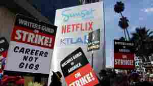 Striking Writers Guild members picket alongside SAG-AFTRA members outside Netflix studios in September of 2023.