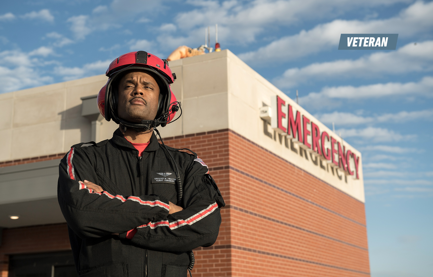 Gregory Proctor Standing in Front of Building