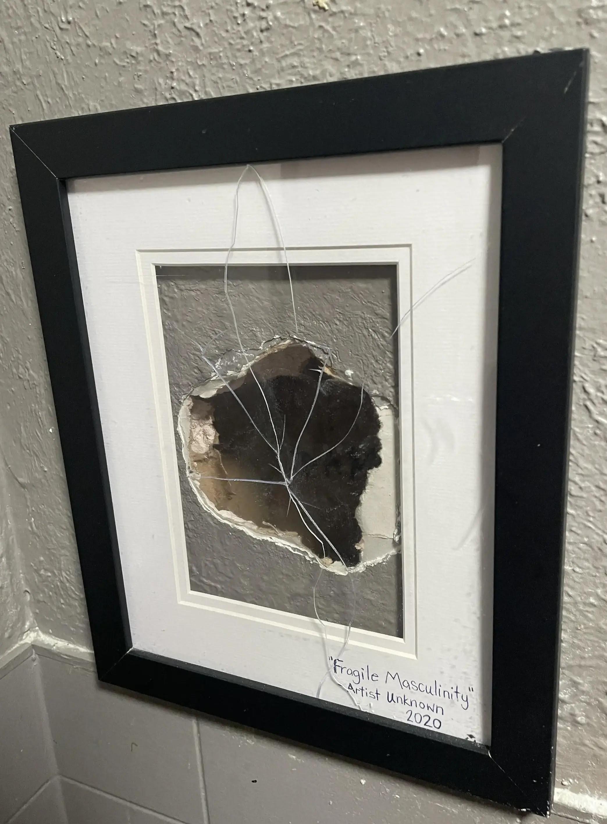 r/mildyinteresting - Restaurant framed a hole someone punched in the men’s bathroom wall