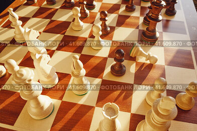 In chess, en passant the capture by a white pawn of an black enemy pawn. Capturing a piece on the aisle in a chess game